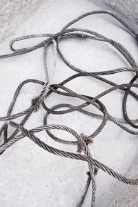 Close-up of rope tied on table
