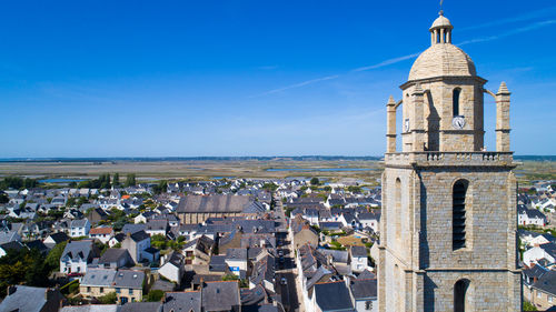 View of bell tower in city against sky