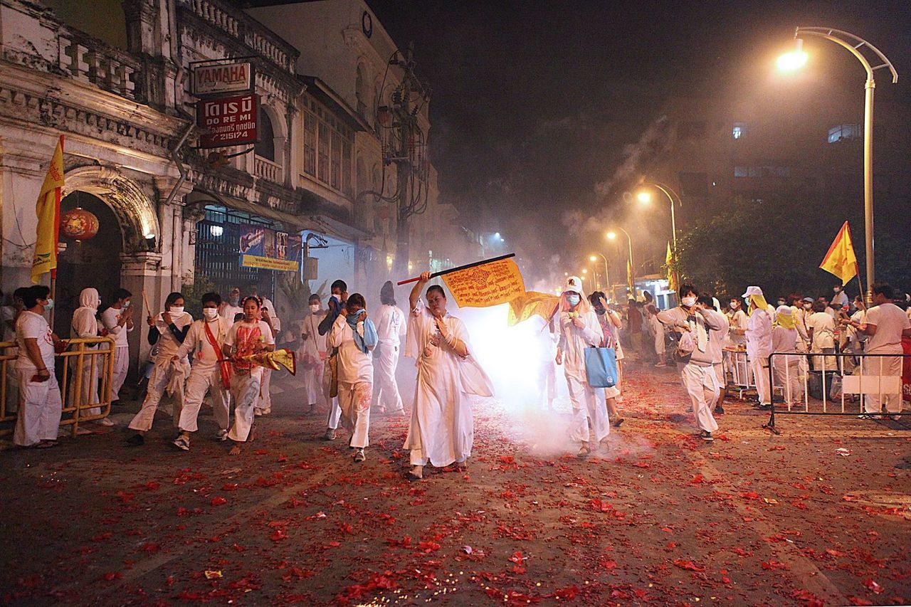 crowd, large group of people, group of people, real people, night, celebration, religion, belief, built structure, ceremony, event, architecture, women, spirituality, traditional clothing, street, illuminated, outdoors, festival