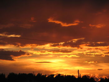 Low angle view of dramatic sky during sunset