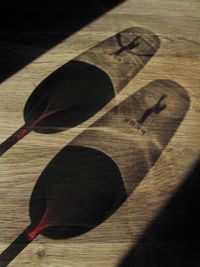 High angle view of shadow on wooden table