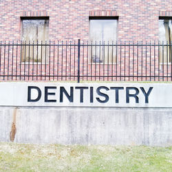 Information sign on brick wall