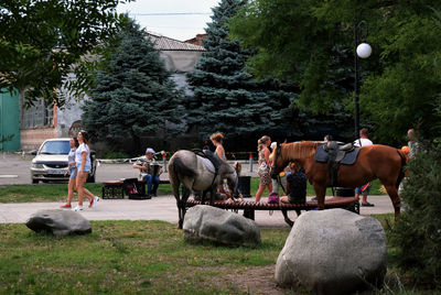 Men in park against sky