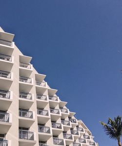 Low angle view of building against blue sky