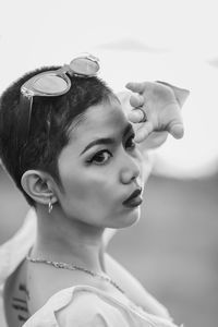 Close-up portrait of young woman looking away