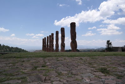 Built structure on field against sky