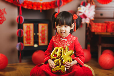 Portrait of cute baby girl in shop