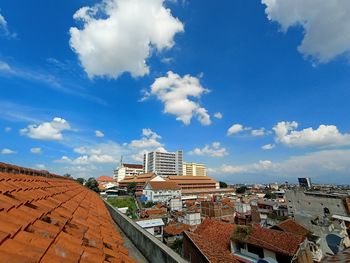 High angle view of townscape against blue sky