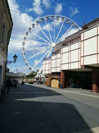 View of ferris wheel in city