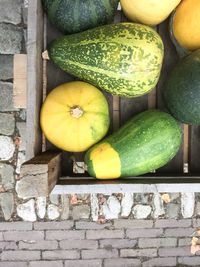 Directly above shot of squashes in crate for sale