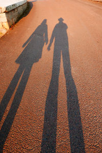Shadow of two people on ground