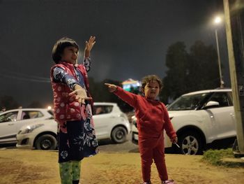 Children playing near the car