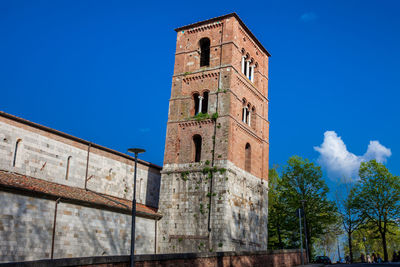 Low angle view of clock tower against sky