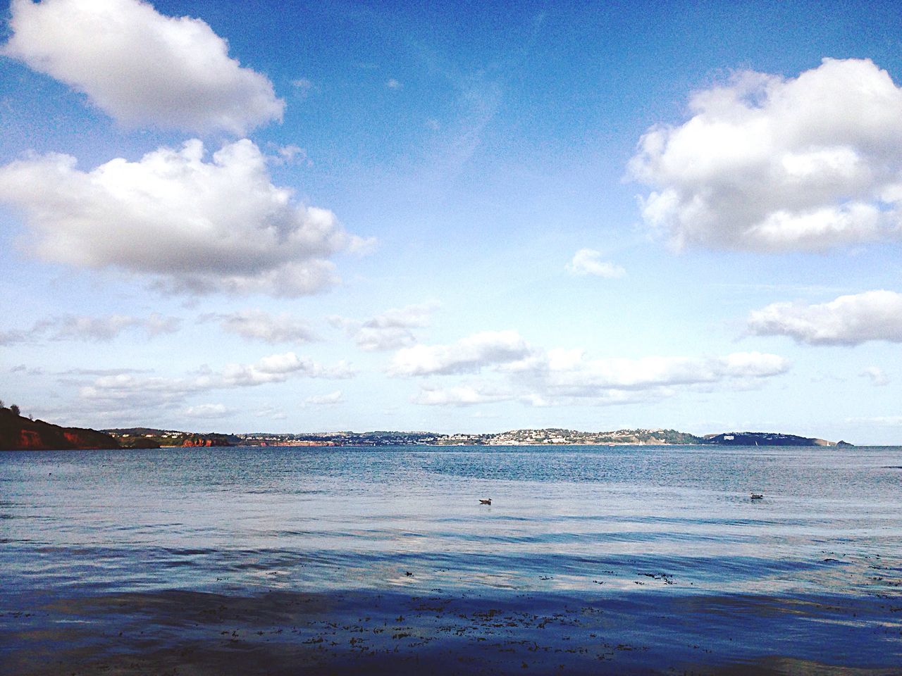 water, sea, sky, tranquil scene, beach, cloud - sky, scenics, tranquility, blue, beauty in nature, cloud, nature, shore, waterfront, cloudy, idyllic, sand, day, horizon over water, outdoors