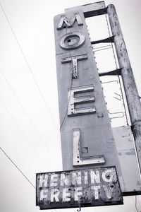 Low angle view of clock tower against sky