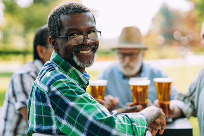 Portrait of man sitting outdoors