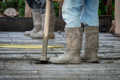 Low section of workers standing at construction site