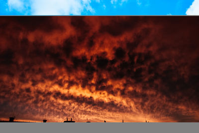 Low angle view of dramatic sky during sunset