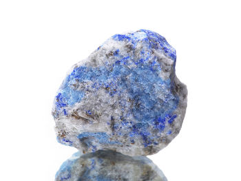 Close-up of blue rock against white background