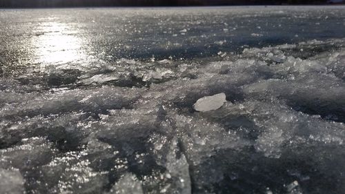 Close-up of waves in sea against sky