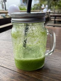 Close-up of drink in glass jar on table