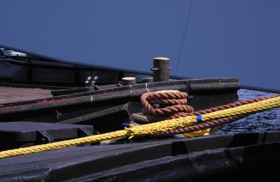 Cropped image of boats moored at harbor