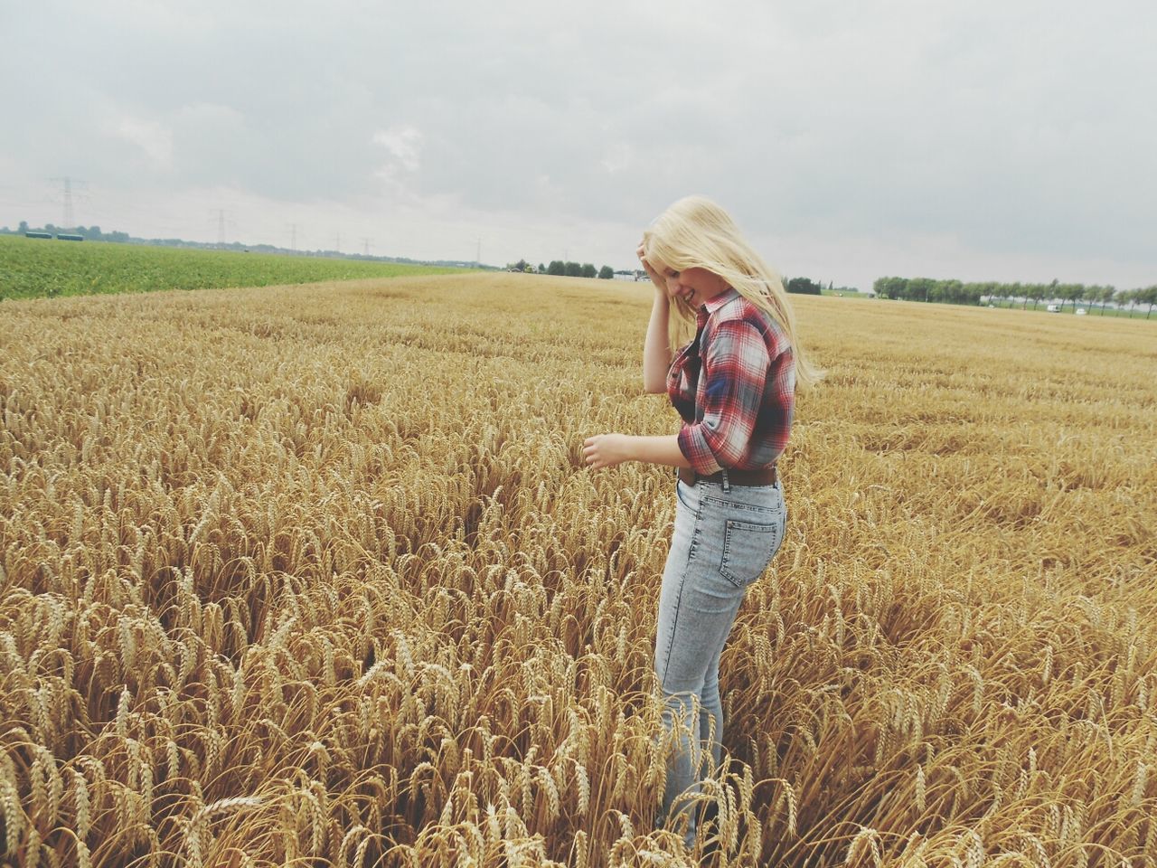 field, lifestyles, grass, sky, leisure activity, casual clothing, full length, person, landscape, young adult, agriculture, rural scene, standing, young women, grassy, farm, cloud - sky, childhood