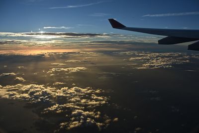 Cropped image of airplane flying over sea