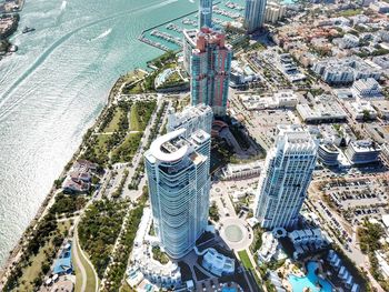 High angle view of buildings by river in city