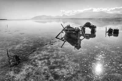 Man in sea against sky
