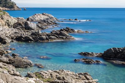 Scenic view of sea against blue sky