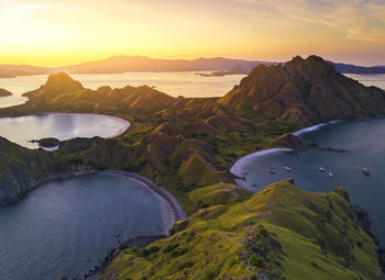 Scenic view of flores island against sky during sunset