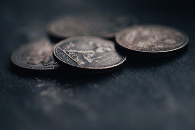 Close-up of coins on table