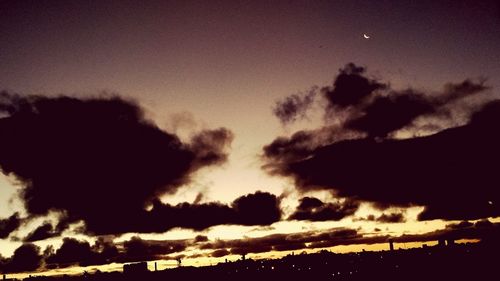 Low angle view of silhouette trees against sky at sunset