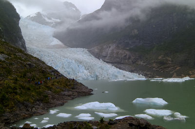 Scenic view of lake and mountains during winter