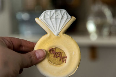 Close-up of man holding human hand