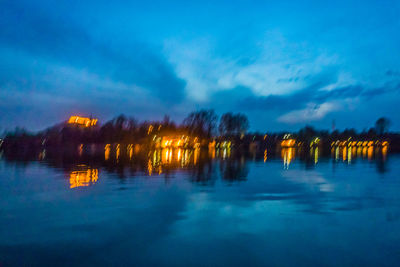 Scenic view of lake against sky at dusk