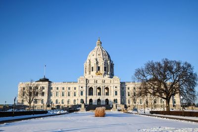 View of building against clear blue sky during winter