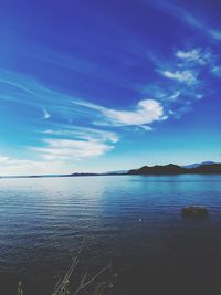 Scenic view of sea against blue sky