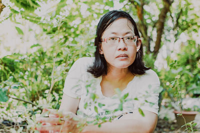 Portrait of woman with plants