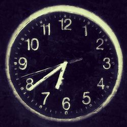 Close-up of clock on wall