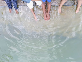 Low section of people in water