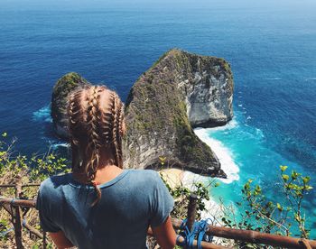 Rear view of woman looking at sea