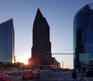 Low angle view of skyscrapers against blue sky