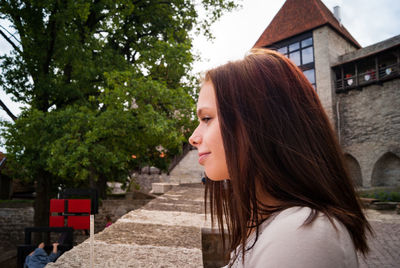 Woman sitting  outdoors