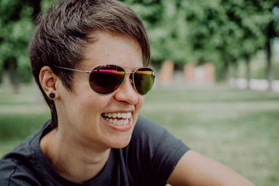 Close-up portrait of happy boy wearing sunglasses