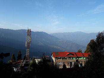 High angle view of houses and trees against sky