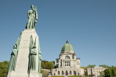 Low angle view of statue of cathedral against sky