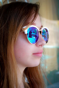 Close-up of young woman wearing sunglasses