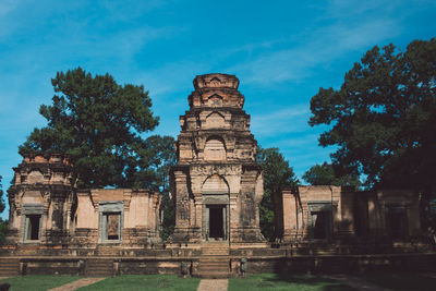 Old temple amidst trees against sky